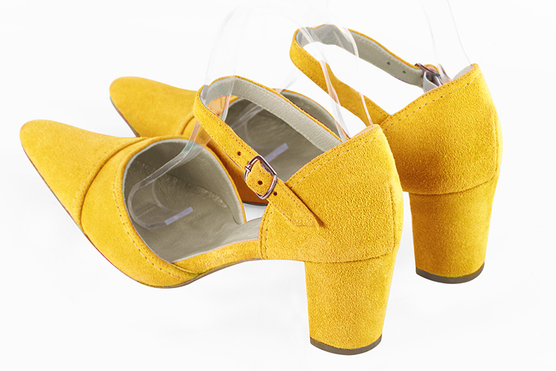 Yellow women's open side shoes, with an instep strap. Tapered toe. Medium block heels. Rear view - Florence KOOIJMAN